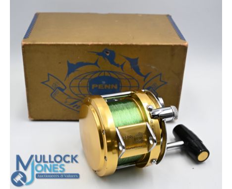 Penn International model 20 Tournament multiplier reel in fine condition, lever drag with preset, rod saddle clamp, reel bag,
