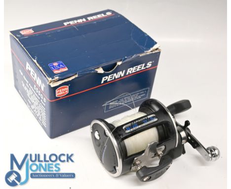 Penn 555 GS multiplier reel, star drag, free spool and ratchet, c/w some spare parts, papers, saddle clamp and MOB