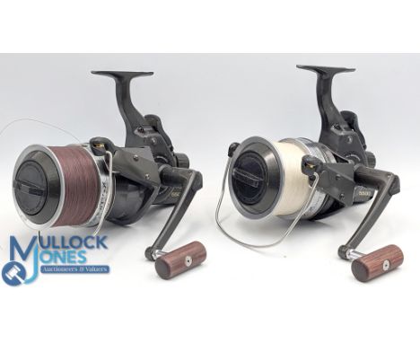Pair of Daiwa Infinity-X 5500 bait runner reels, long cast spools, folding handle, one drag control knob loose, otherwise goo