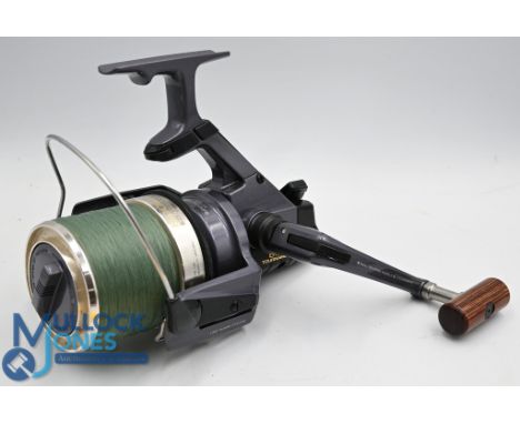 Daiwa 6000T Tournament S, long cast reel, made in Japan, folding handle, twist buster bail arm, fine, c/w 2 free spool bait r