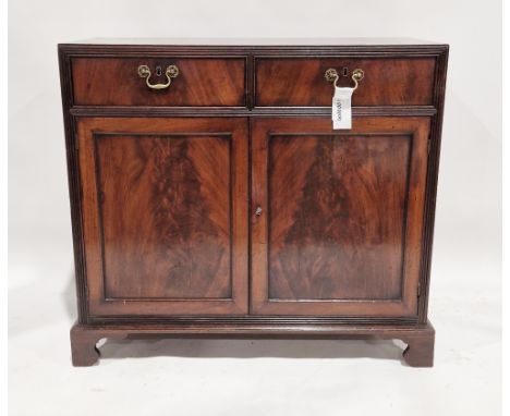 Early 19th century mahogany side cabinet, the top cross-banded, the two drawers and two panel cupboard doors with reeded surr