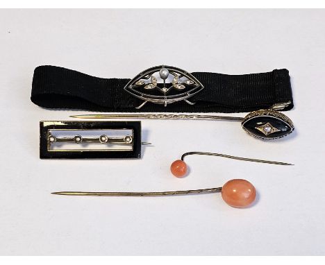 Gold-coloured metal, onyx and seedpearl tiepin&nbsp;having elliptical-shaped top, a seedpearl and white metal buckle on black