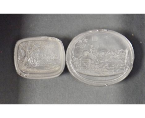 Two 19th century rock crystal seals, both with carved with hunting scenes, one oval 3.4cm long and the other rectangular 2.4c