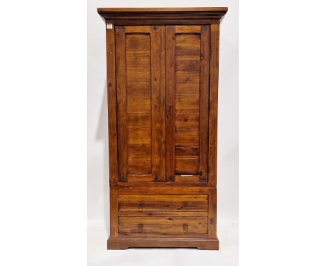 Modern hardwood wardrobe, the two panelled doors opening to a shelf and hanging compartment, over two long drawers below, 184