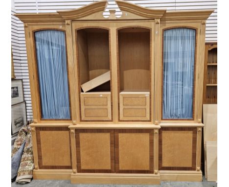 A 20th century beech, mahogany and burr wood large breakfront display cabinet, the broken swan neck pediment over a central s