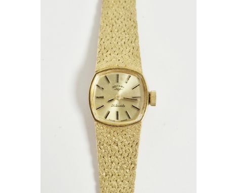 Lady&rsquo;s Rotary 9ct gold wristwatch with champagne-coloured rounded square face, bark-finish integral strap, 25.3g total&