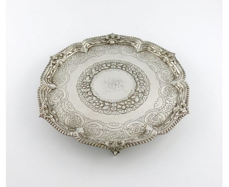 A George III silver salver, by Ebenezer Coker, London 1766, circular form, gadroon border, the centre with later chased folia