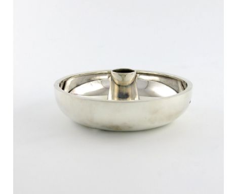By Christopher Lawrence, a modern silver candlestick, London 1977, plain circular dish form, with a central spreading stem, d