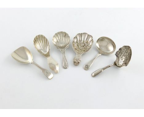 A collection of six silver caddy spoons, comprising: a George III one, by Joseph Willmore, Birmingham 1816, oval bowl, emboss