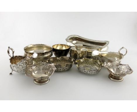A mixed lot of silver items, various dates and makers, comprising: a George III cruet stand base, London 1819, a two handled 