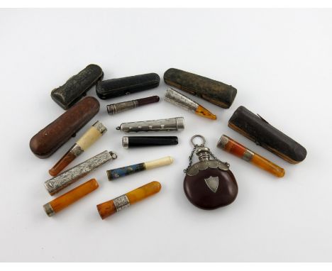 λ A mixed lot of silver items, comprising: an unmarked mounted nut scent bottle, with a hinged cover and chain and ring attac