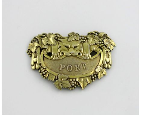 A George III cast silver-gilt leopard's pelt wine label, by Paul Storr, London 1810, shaped form, titled 'PORT' on a textured