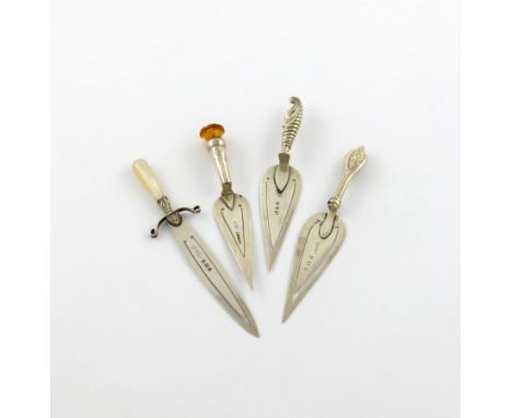 A small collection of four silver page markers, various dates and makers, comprising: one with an orange thistle terminal, tw