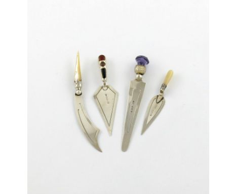 A small collection of four silver page markers, various dates and makers, comprising: one with a purple thistle terminal, one