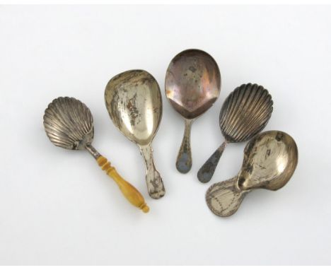 λ A mixed lot of silver caddy spoons, various dates and makers, comprising: one with Bright-cut decoration, London 1883, two 