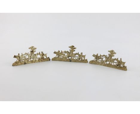 A set of three Edwardian silver menu card holders, by Stuart Clifford, London 1903, each pierced and cast with a hunting scen