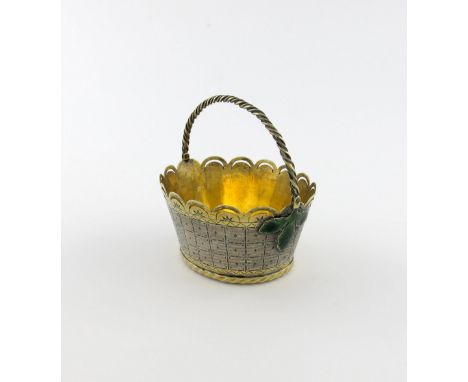 A continental parcel-gilt silver and enamel swing-handled basket, unmarked, oval form, rope-work swing-handle, pierced wavy-e