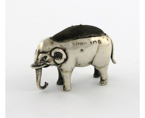 An Edwardian novelty silver elephant pin cushion, by Adie and Lovekin, Birmingham 1906, modelled in a standing position, trun