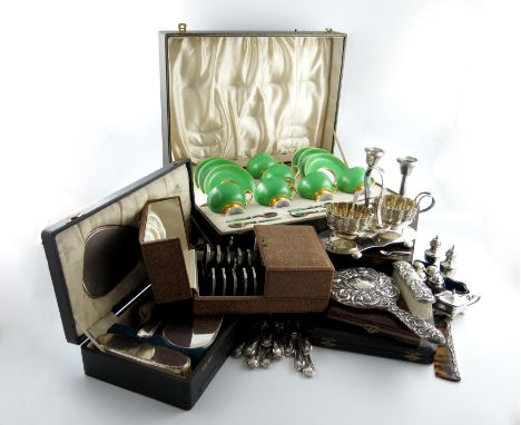 λ A mixed lot, comprising silver items: a pair of candlesticks, Birmingham 1911, a set of three cased toast racks, a cased fi