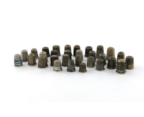 A collection of thirty silver and white-metal thimbles, various dates and makers, the majority Chester made, including one wi