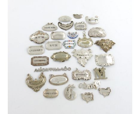 A mixed lot of wine labels, comprising silver examples: an oval label, maker's mark only JS, script, incised 'CLARET H', a Fr