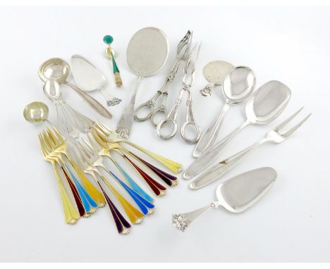 A collection of Scandinavian silver flatware, comprising: eleven silver-gilt and enamel cake forks and a pair of sugar tongs,