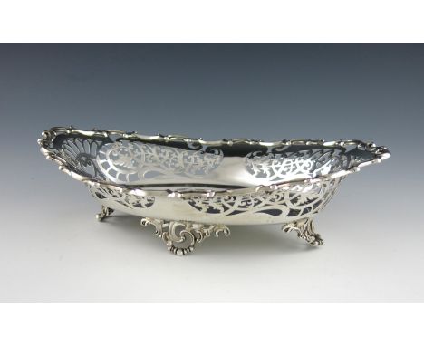 An Edwardian silver basket, by William Hutton and Son, Sheffield 1901, oval form, pierced foliate scroll decoration, pierced 