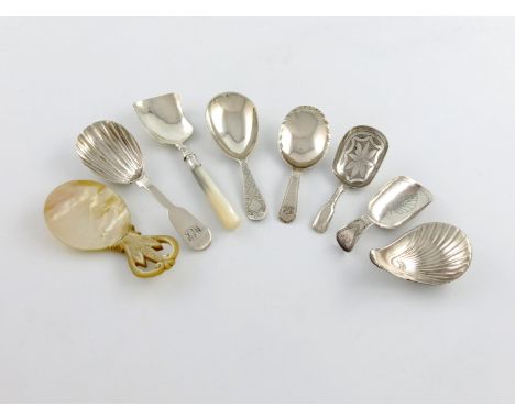 A collection of six antique silver caddy spoons, comprising: one with a feather-edge border, two with bright-cut decoration, 