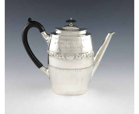 A Royal Victorian silver presentation coffee pot, by E. Hutton, London 1887, oval form, part-fluted decoration, scroll handle