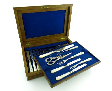 A set of eighteen Victorian silver fruit knives and forks with a serving knife and fork and a pair of grape scissors, by Henr