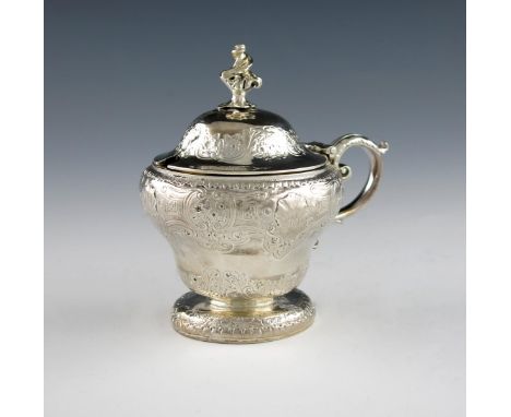 A George IV silver mustard pot, by Paul Storr, London 1826, circular baluster form, leaf capped scroll handle, chased foliate