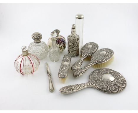 A mixed lot of silver items, various dates and makers, comprising: an Edwardian silver-mounted glass scent bottle with red ri