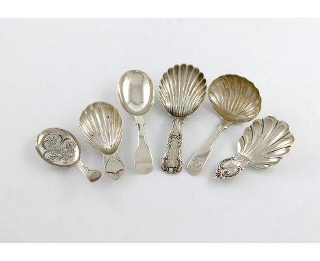 A collection of six antique silver caddy spoons, comprising: a George III example, by Joseph Willmore, Birmingham 1806, the o