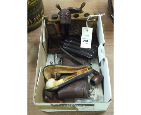 An oak pipe stand; pipes; and cigar cases.