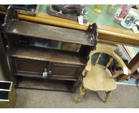 A child's wooden armchair on turned wood legs; together with an early 20th Century wall hanging shelf unit, fitted a cupboard