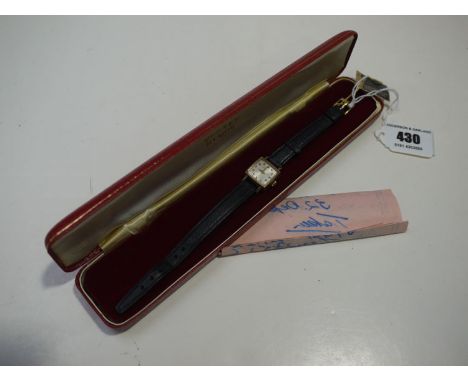 A vertex 9ct. yellow gold cased lady's wristwatch, on a leather strap in original case and with original receipt from Army & 