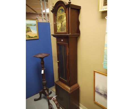 A reproduction mahogany longcase clock with arched brass dial and glazed centre door.