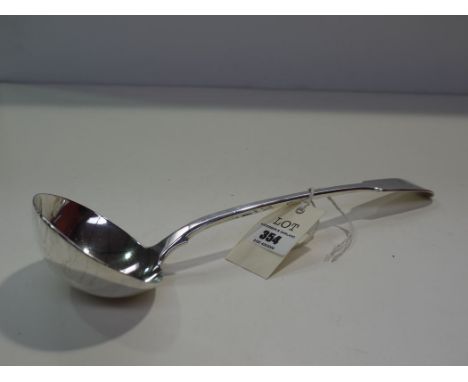 A George IV ladle, by John Hawkins, London 1824, fiddle pattern, engraved crest, 9.37oz.