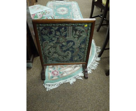 A needlework firescreen in mahogany frame.