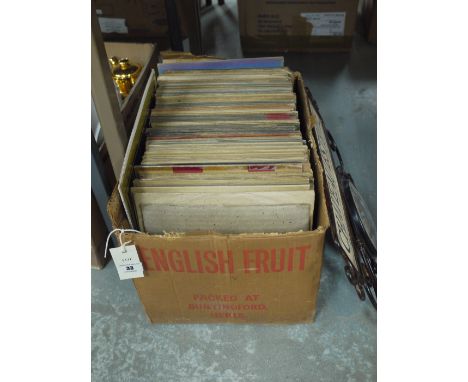 A box of jazz records, including: Pete Daily & His Chicagoans; Basin Street Blues by Louis Armstrong & His Orchestra; I'm Loo