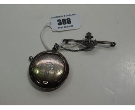 A silver compact, the engine turned cover engraved "given" and mirror to interior; together with a Royal Navy bar brooch.