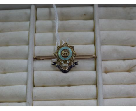 A yellow metal and enamel regimental sweetheart brooch for the Worcestershire Regiment, bar stamped 15ct.