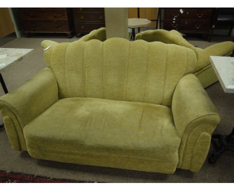 An early 20th Century Art Deco style three-piece suite, comprising: a two-seater settee; and a pair of matching armchairs wit