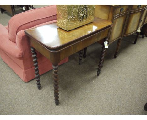 A 19th Century antique mahogany turnover top card table with inlaid baize playing surface, raised on spiral twist legs (badly