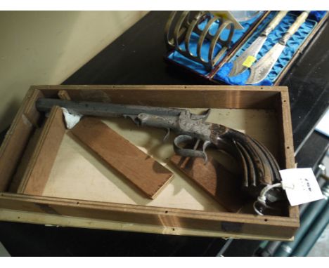 A reproduction model of a 19th Century rim fire pistol, the octagonal  barrel and lockplates engraved with foliate design, fl