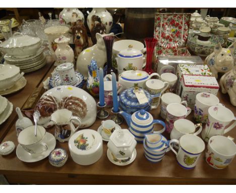 A quantity of Ringtons ware mugs; two tea pots; a tea caddy; and other sundry china.