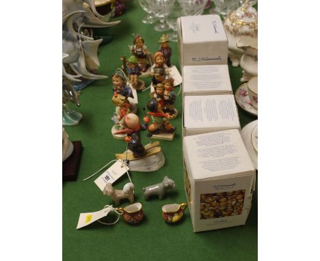 Ten Hummel figurines, some boxed; together with two miniature Coalport jugs; etc.