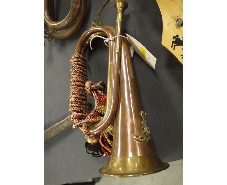A copper military bugle.