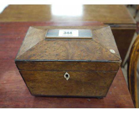 A Georgian birdseye maple tea caddy.