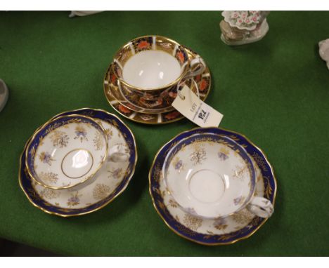 A Royal Crown Derby "Imari" pattern cup, saucer and plate; together with Victorian cups and saucers with blue band and gilt d